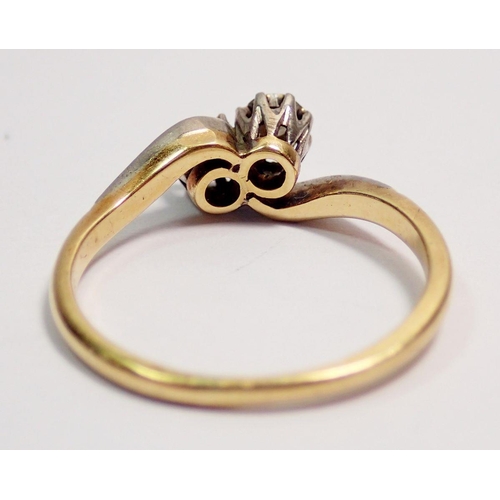 405 - An Edwardian 18 carat gold ring crossover set two illusion set diamonds, size K, 2.4g