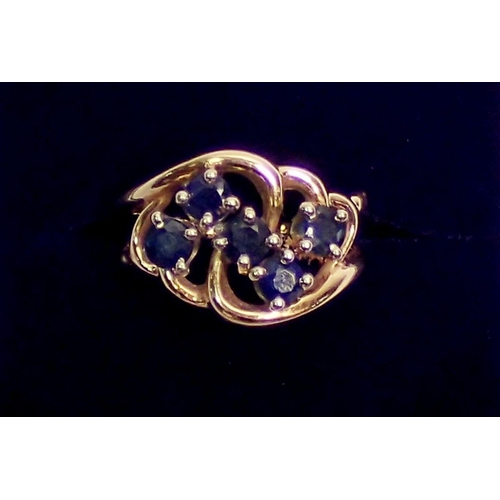 407 - A yellow metal ring with asymetrical design set five sapphires, size K to L, 4g