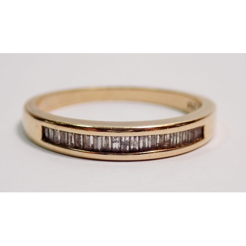 410 - A 9 carat gold ring set row of baguette cut diamonds, size O, 2.3g