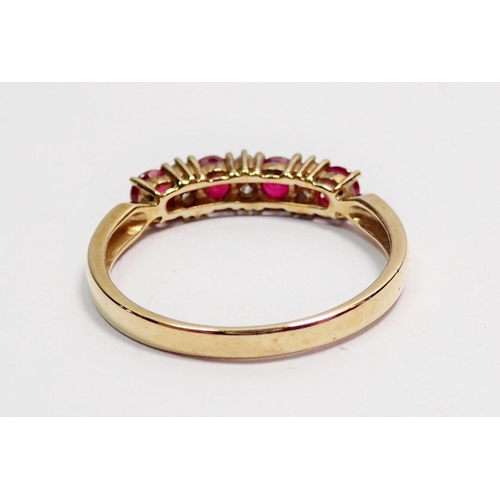 415 - A 9 carat gold ring set row of four rubies and six diamonds, size P, 1.8g