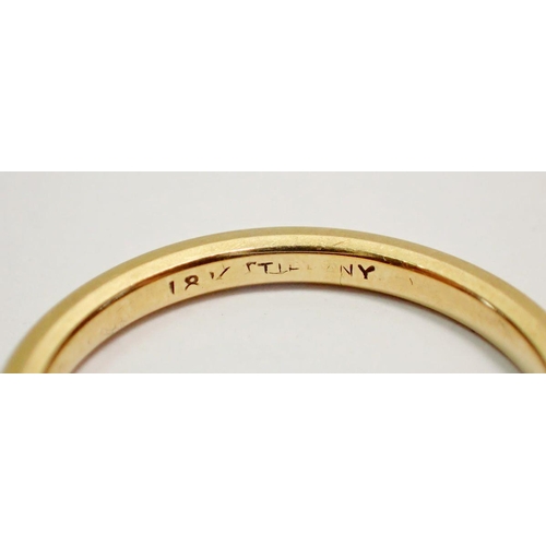 417 - A Tiffany 18k gold wedding ring, size J, 2.2g