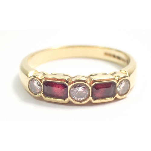 419 - An 18 carat gold ruby and diamond ring, the two rubies 0.52 cts each and the diamonds 0.1ct each, co... 