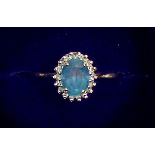 420 - A 9 carat gold cluster ring set blue topaz and diamonds, size O-P, 2.3g