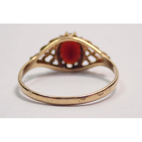 421 - A 9 carat gold ring set garnet, size S, 2g