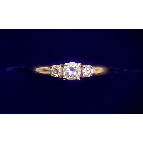 422 - A 9 carat gold ring set diamond flanked by two smaller diamonds, size M, 1.8g