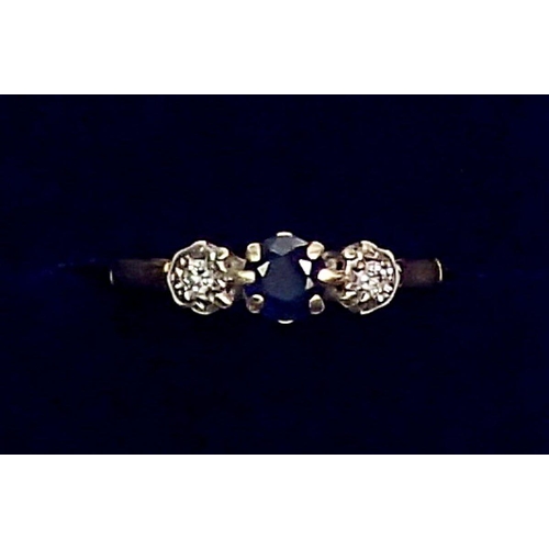 425 - An 18 carat gold and platinum sapphire and diamond ring, size P, 3.4g