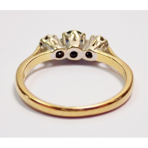 425 - An 18 carat gold and platinum sapphire and diamond ring, size P, 3.4g