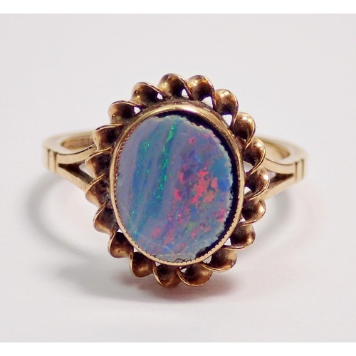 426 - A 9 carat gold ring set oval opal doublet, size K-L, 2.1g