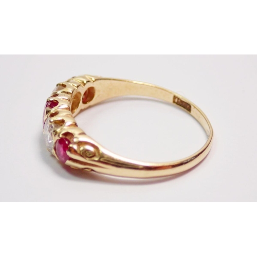 427 - A 15 carat gold ring set three rubies and two diamonds, size M, 2.2g