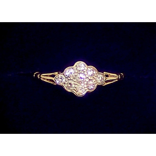 429 - An 18 carat gold ring set panel of nine diamonds, size M to N, 2.8g