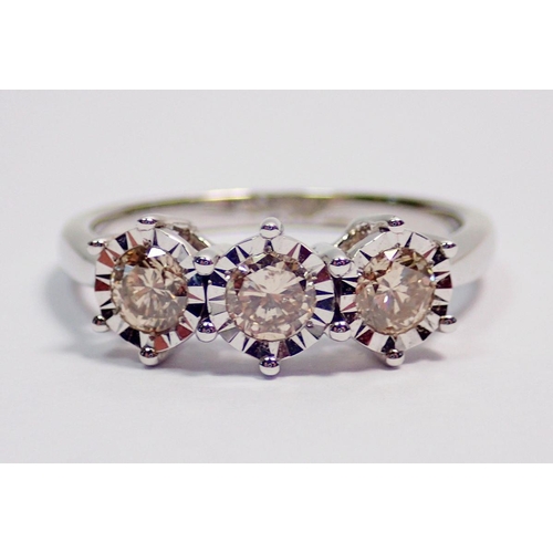 430 - A 9 carat white gold ring illusion set three diamonds, size K (approx 0.5ct total diamond weight)