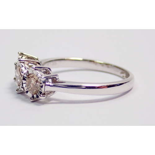 430 - A 9 carat white gold ring illusion set three diamonds, size K (approx 0.5ct total diamond weight)