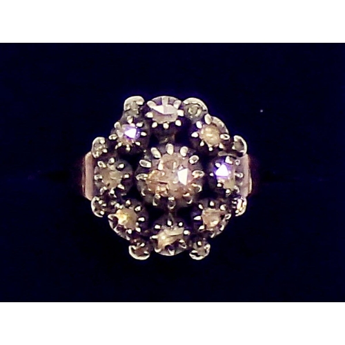 433 - A Georgian cluster ring set old cut diamonds on later yellow metal band, size R, 5.4g