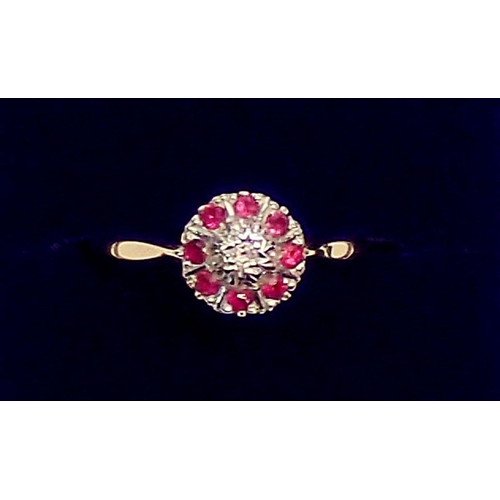 434 - An 18 carat gold diamond and ruby cluster ring, size O-P, 2.5g