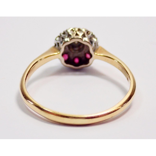 434 - An 18 carat gold diamond and ruby cluster ring, size O-P, 2.5g