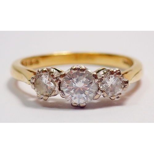 435 - An 18 carat gold three stone diamond ring, size J, 2.5g