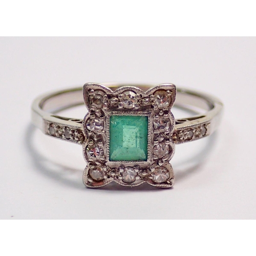 437 - An 18 carat white gold or platinum ring set emerald in square diamond surround on diamond set should... 