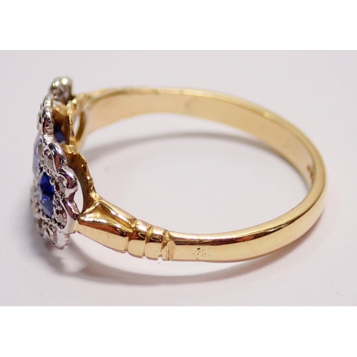 441 - An 18 carat gold ring set three sapphires within diamond surround, size K to L, 2.5g