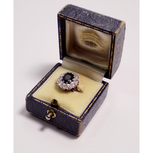 443 - An 18 carat gold sapphire and diamond cluster ring, sapphire 8 x 6mm, size N, 5.2g - boxed