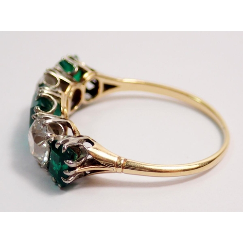 446 - A fine 18 ct gold ring set three emeralds and two diamonds, size O-P, the diamonds 5mm diameter, the... 