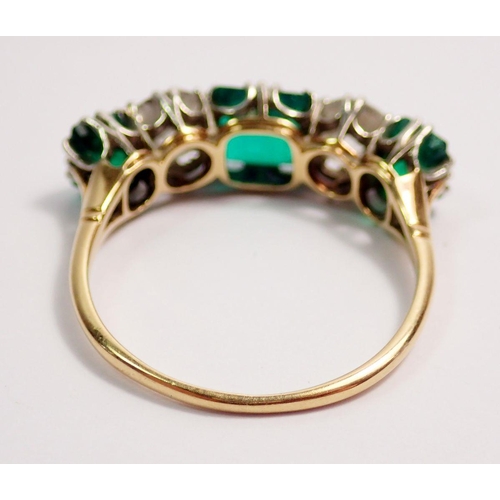 446 - A fine 18 ct gold ring set three emeralds and two diamonds, size O-P, the diamonds 5mm diameter, the... 