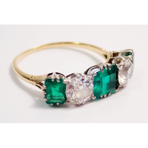 446 - A fine 18 ct gold ring set three emeralds and two diamonds, size O-P, the diamonds 5mm diameter, the... 