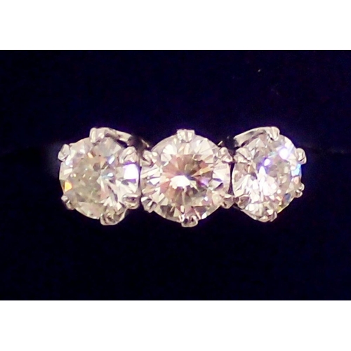 448 - A fine platinum three stone diamond ring, approx 3cts in total, size L to M, 7.4g