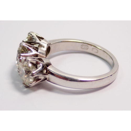 448 - A fine platinum three stone diamond ring, approx 3cts in total, size L to M, 7.4g