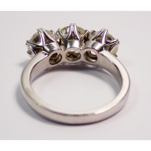 448 - A fine platinum three stone diamond ring, approx 3cts in total, size L to M, 7.4g