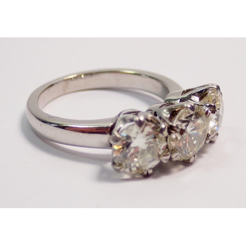 448 - A fine platinum three stone diamond ring, approx 3cts in total, size L to M, 7.4g