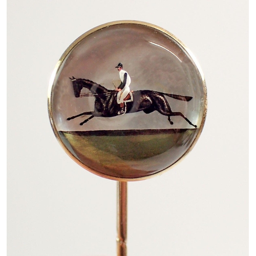 456 - An antique Essex crystal stick pin with jockey and race horse, set in 18 carat gold with original ca... 