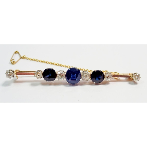 458 - A fine 15 carat gold and platinum bar brooch set three sapphires and six diamonds, 1.25 cts diamonds... 