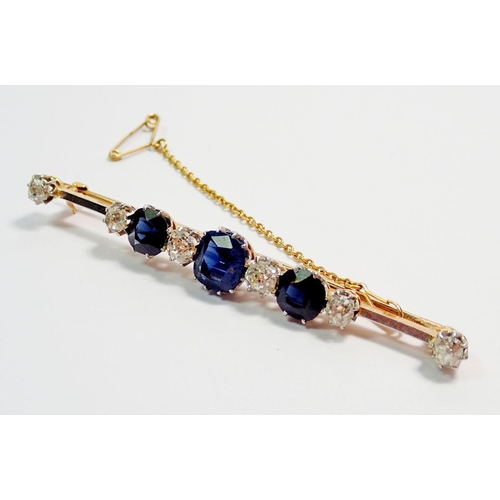 458 - A fine 15 carat gold and platinum bar brooch set three sapphires and six diamonds, 1.25 cts diamonds... 