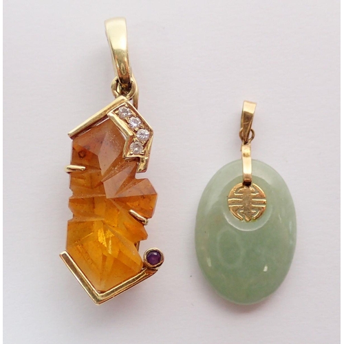 459 - A 14kt gold mounted rough cut citrine pendant set four diamonds, 4.8g and a Chinese 14kt gold mounte... 