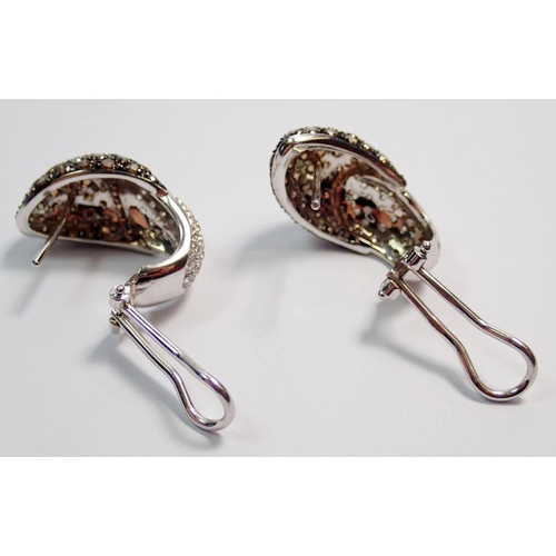 463 - A pair of white gold earrings pave set with white and brown diamonds, pierced fittings with clips, 2... 