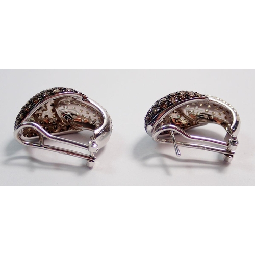 463 - A pair of white gold earrings pave set with white and brown diamonds, pierced fittings with clips, 2... 