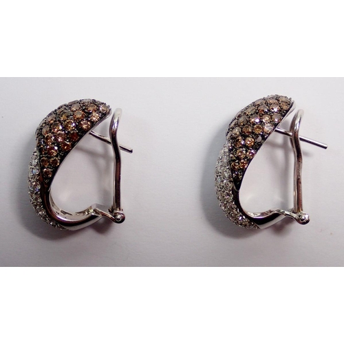 463 - A pair of white gold earrings pave set with white and brown diamonds, pierced fittings with clips, 2... 