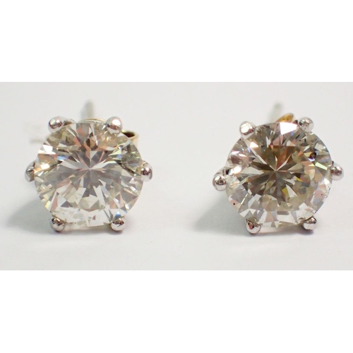 470 - A pair of large diamond stud earrings set in white gold, total diamond weight approx 2cts 70 points