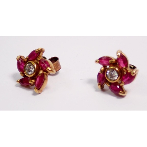 472 - A pair of ruby and diamond spiral cluster earrings, 7mm diameter, 2g