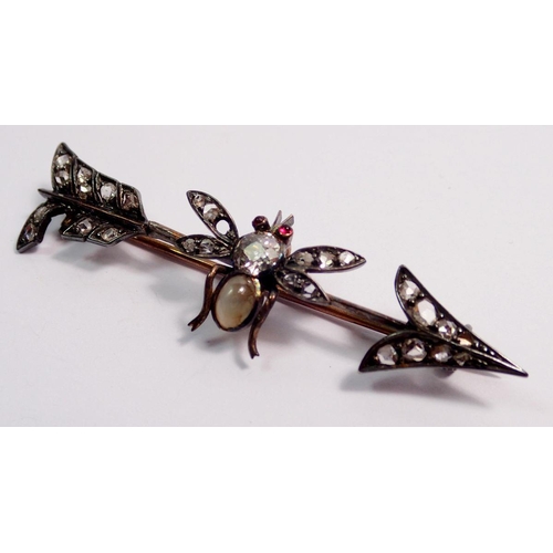 478 - An antique silver arrow form brooch with bee set old cut diamonds, moonstone body and ruby eyes, a/f... 