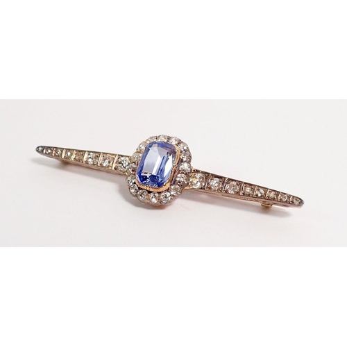 486 - A fine platinum and 15 carat gold bar brooch set central pale blue sapphire within sixteen stone dia... 