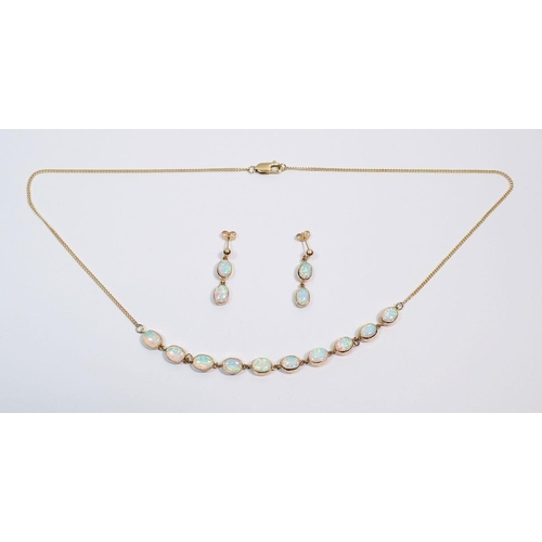 490 - A 9 carat gold necklace set ten oval black opals, 53cm long plus a pair of matching pendant opal ear... 