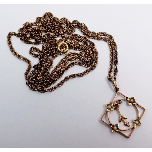 500 - An Edwardian gold openwork square pendant set seed pearls 1.4g, 2.2cm drop on gold plated chain 76cm