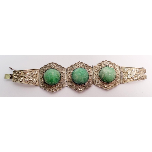 507 - A Chinese jadeite and sterling silver bracelet and matching brooch plus a similar ring, all with flo... 