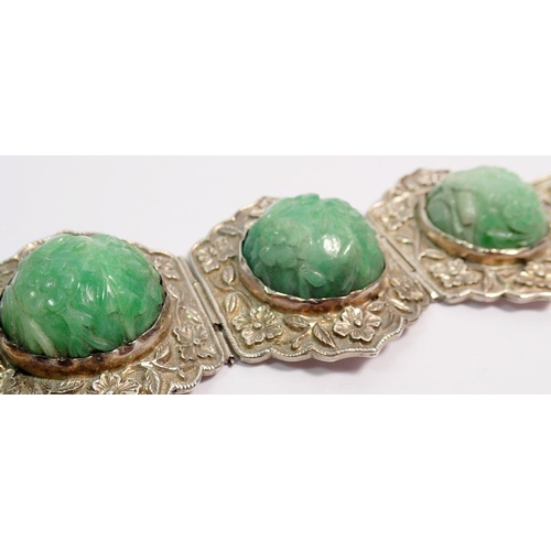 507 - A Chinese jadeite and sterling silver bracelet and matching brooch plus a similar ring, all with flo... 