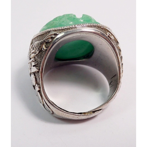 507 - A Chinese jadeite and sterling silver bracelet and matching brooch plus a similar ring, all with flo... 