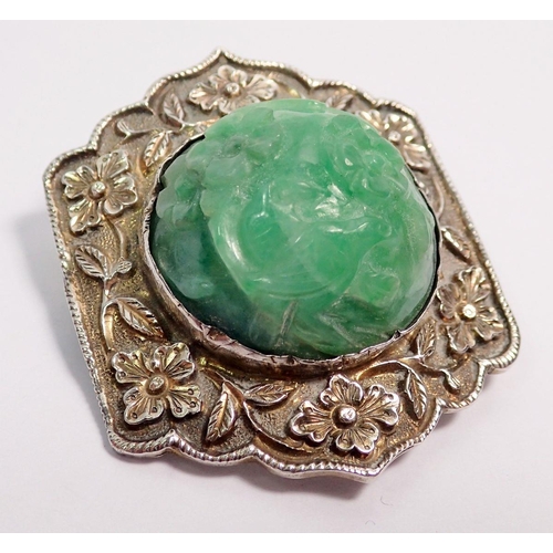 507 - A Chinese jadeite and sterling silver bracelet and matching brooch plus a similar ring, all with flo... 