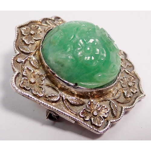 507 - A Chinese jadeite and sterling silver bracelet and matching brooch plus a similar ring, all with flo... 