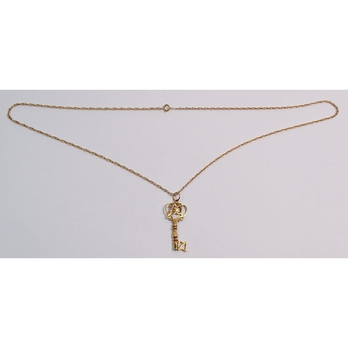 520 - A 9 carat gold pendant in the form of a '21' key, 2.7g, 3.5cm drop on yellow metal chain, 2.9g