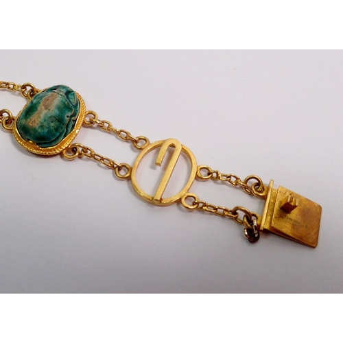 540 - An antique gold and scarab beetle bracelet with four decorative oval links and three scarabs, 19g - ... 